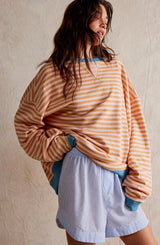 Women's Striped Oversized Sweater in Orange Stripes, on model