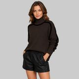 Women's Ribbed Oversized Contrast-Trim Turtleneck Sweater in Brown, on model